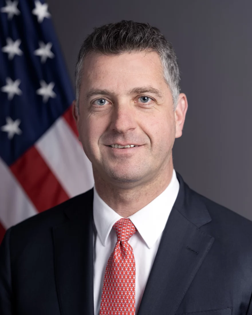 Headshot or formal portrait of Mike Needham